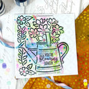Colorful card with floral design and text 'You're Blooming Lovely' on a white background.
