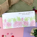 Floral card with text on a polka dot surface with buttons and burlap.