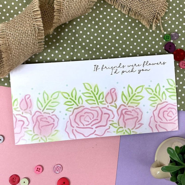 Floral card with text on a polka dot surface with buttons and burlap.