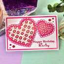 Birthday card with heart designs and 'Happy Birthday, Darling' text on a colorful background.