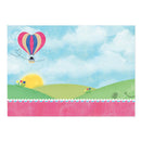 Colorful hot air balloon in a scenic landscape with green hills and a blue sky.