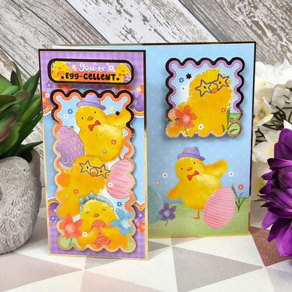Colorful Easter-themed greeting cards with chicks and decorative elements on a wooden surface.