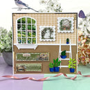 Greeting card with garden-themed decorations and a bird on a branch.