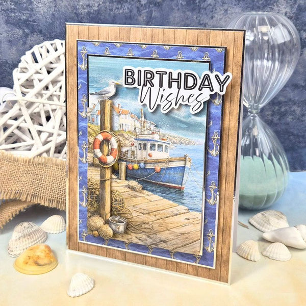 Nautical-themed birthday card with a boat and seagull design, surrounded by beach decor.