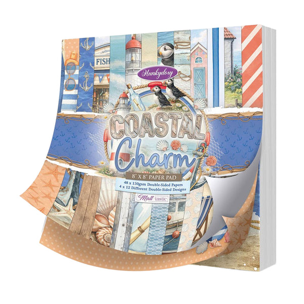 Hunkydory Coastal Charm paper pad packaging with scenic designs on a white background