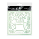 Stencil with floral design and watering can on a white background