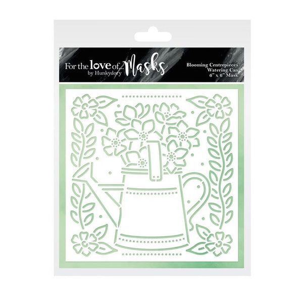 Stencil with floral design and watering can on a white background