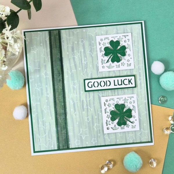Greeting card with shamrock designs and 'Good Luck' text on a decorative background.