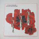 Red flowers with a motivational quote on a white background