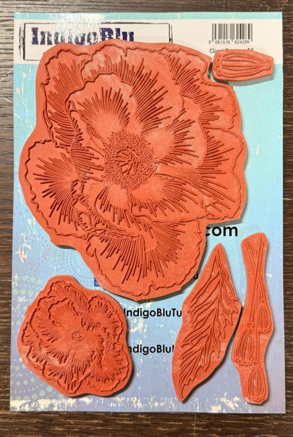 Set of red floral stamps on a blue card with 'IndigoBlu' branding.