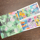Colorful art supplies on a wooden surface