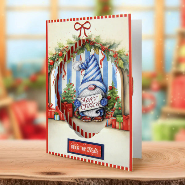 Christmas-themed greeting card with a gnome and festive decorations on a wooden surface.