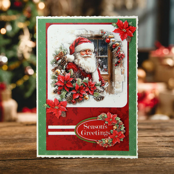 Christmas card with Santa Claus, poinsettias, and 'Season's Greetings' text on a wooden surface.