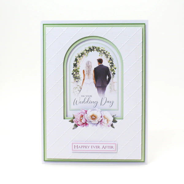 Wedding card with a couple under a floral arch and decorative text on a white background