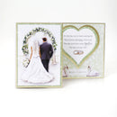 Wedding card with a couple under a floral arch and text.