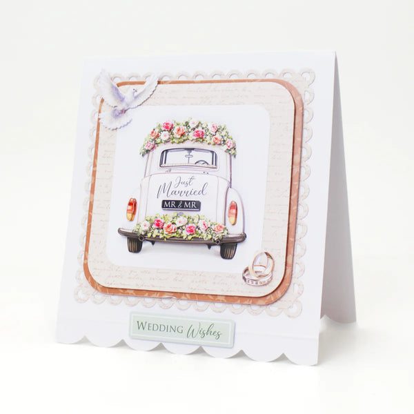Wedding-themed card with a vintage car and floral decorations on a white background