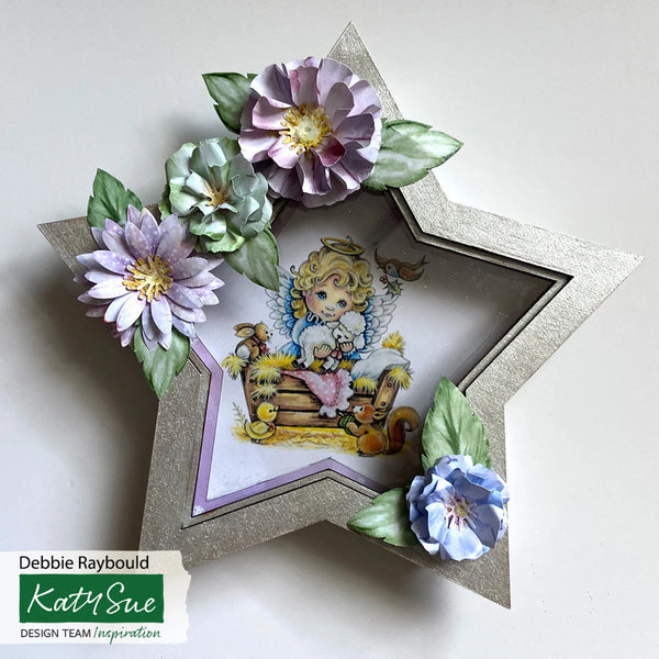 Decorative star-shaped card with floral elements and an angel illustration on a white background.