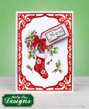 Christmas card with a red stocking and holly design on a white background, featuring the brand 'Katy Sue Designs'.