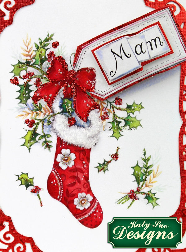 Decorative Christmas card with a red stocking, holly, and a 'Mam' tag, featuring Holly Jive Designs logo.