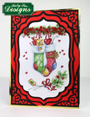 Decorative Christmas card with a colorful stocking and red border, featuring Katy Sue Designs branding.