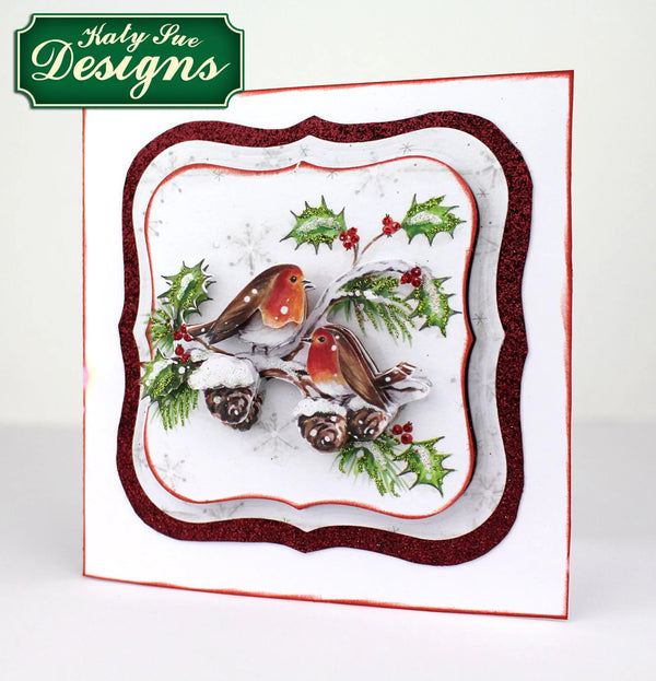 Decorative plate with winter scene featuring birds and holly, branded 'Katy Sue Designs'.