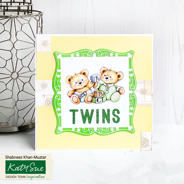 Card with teddy bears and 'TWINS' text on a yellow background, featuring Katy Sue design.