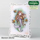 Card with a mermaid design featuring fish and a decorative frame, branded with Katy Sue Designs.