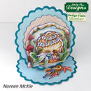 Decorative card with mermaid design inside a shell, featuring 'Kathy Sue Designs' on a white background.