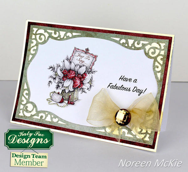 Greeting card with floral design and decorative bow, featuring Katelyn Fee Designs branding.
