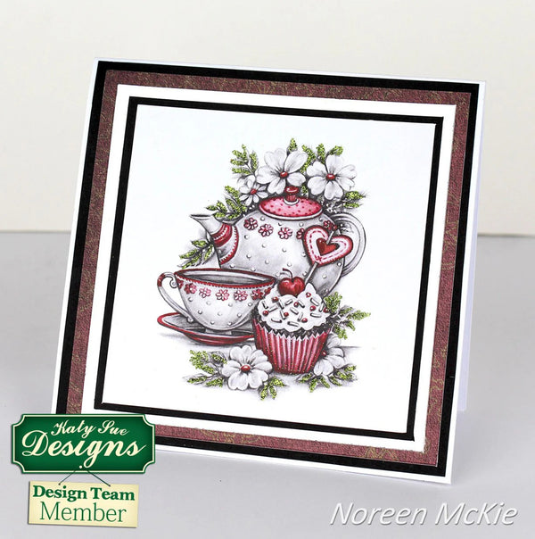 Card with a teapot, cup, and cupcake illustration featuring Katy Sue Designs branding.
