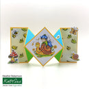 Colorful geometric card with fairy and snail design, featuring Katy Sue branding.