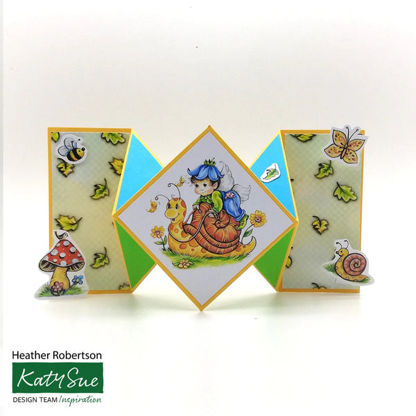 Colorful geometric card with fairy and snail design, featuring Katy Sue branding.