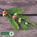 Decorative green leaf and berry embellishment on a wooden surface with Katy Sue Flower Pro branding.