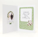 Wedding card with a photo of a couple and floral design on a white background