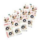Collection of decoupage sheets with champagne bottles, flowers, and records on a white background