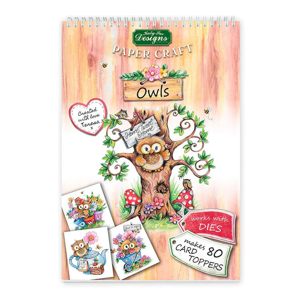 Paper craft kit with owl designs and illustrations on a wooden background