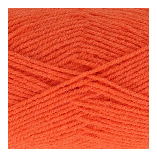 Close-up of bright orange yarn on a white background