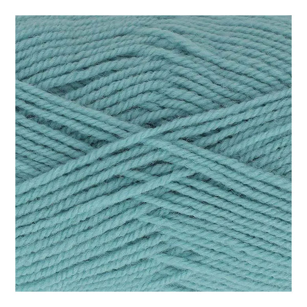 Close-up of teal yarn on a white background