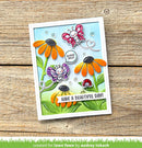 Colorful card with flowers and butterflies on a wooden surface, created by Audrey Tokach for Lawn Fawn.