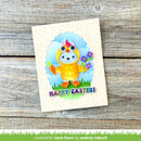 Colorful Easter card with a cartoon chick on a wooden surface