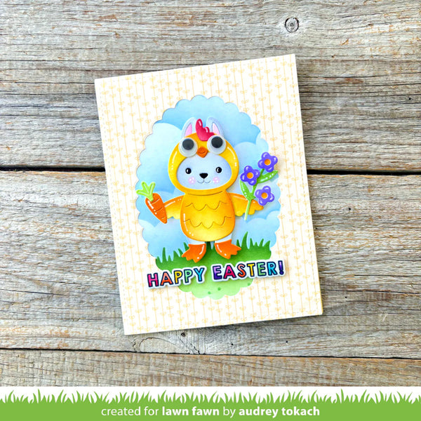 Colorful Easter card with a cartoon chick on a wooden surface