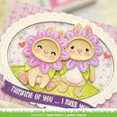 Card with two flower-like characters and a 'Thinking of you' message on a pink background.