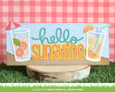 Decorative sign with 'hello sunshine' text and lemonade graphics on a checkered background