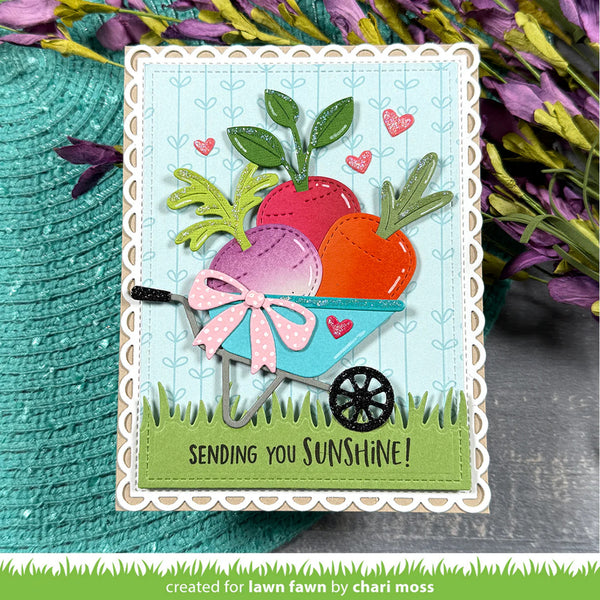 Card with colorful radishes in a wheelbarrow and 'Sending you sunshine!' text, surrounded by flowers.