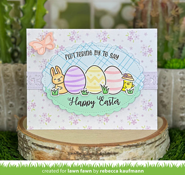 Easter card with colorful eggs and bunny on a decorative stand with plants in the background