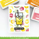 Card with a cartoon juice box and fruit design, surrounded by ink pads, on a white background.