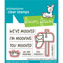Lawn Fawn photopolymer clear stamps with moving-themed phrases and graphics on a blue background.