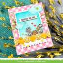 Colorful card with cartoon mice, lemon slices, and 'Squeeze the Day' text on a checkered border.