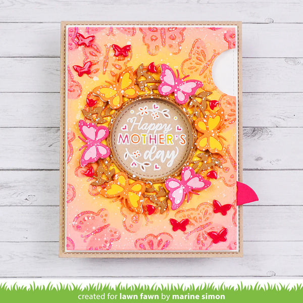 Colorful card with butterflies and 'Happy Mother's Day' text on a wooden surface