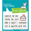 Lawn Fawn photopolymer clear stamps with text and graphics on a blue background